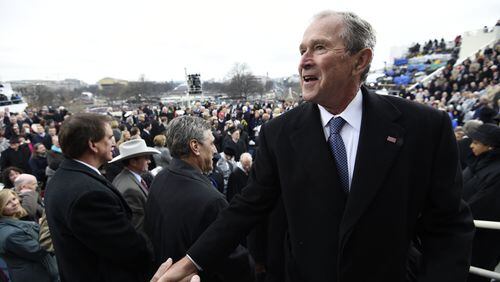 Former US President George W. Bush leaves after the Presidential Inauguration at the US Capitol on January 20, 2017 in Washington, DC. (Photo by Saul Loeb - Pool/Getty Images)