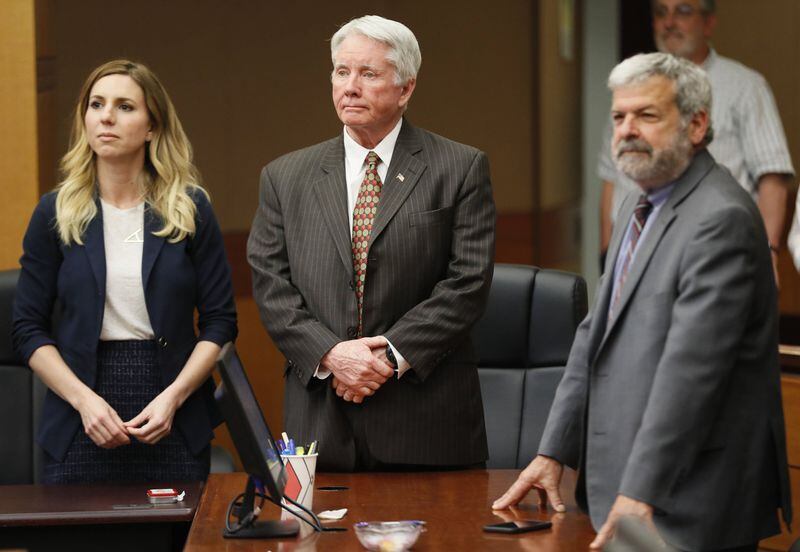 Tex McIver stands with attorneys Amanda Clark Palmer (left) and Don Samuel on Friday, April 20, 2018, in the Tex McIver murder trial at the Fulton County Courthouse. 