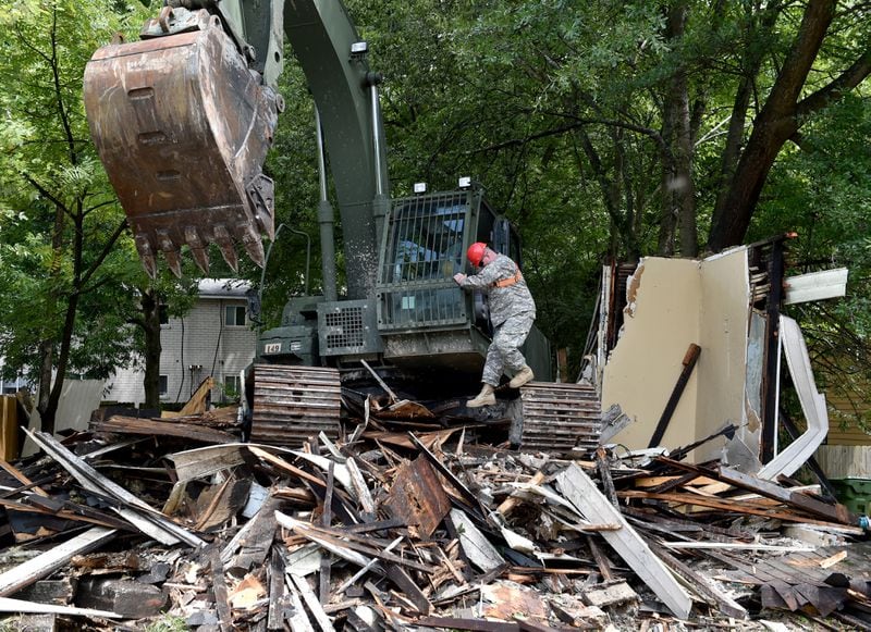 Blighted properties in the English Avenue neighborhood being torn down in 2015 by the Georgia National Guard Counterdrug Task Force as part of their Counterdrug Initiative. (Brant Sanderlin / AJC 2015 file photo)