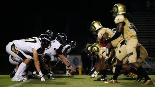 The Colquitt County offense lines up against the Grayson defense during the first half of a high school football game between Grayson and Colquitt County at Grayson High School in Loganville, Ga., on Fri., Sept. 21, 2018. (Casey Sykes for The Atlanta Journal-Constitution)