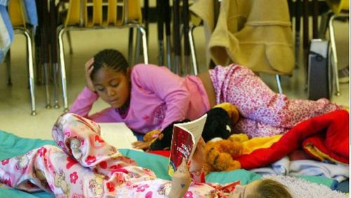 Lake Windward, the top scoring elementary school in metro Atlanta in third-grade language arts, has fostered reading through such events as “Writing and Reading All Day” in which means students and staff wear their pajamas all day to read and write. (PHOTO BY PHIL SKINNER/staff)