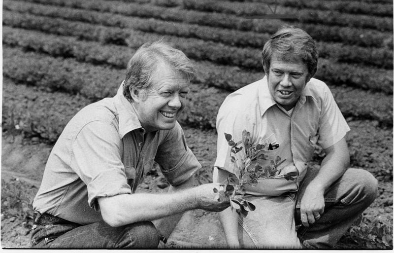1976 - Plains, Ga - President Jimmy Carter and his brother Billy talk peanuts in Plains in 1976.