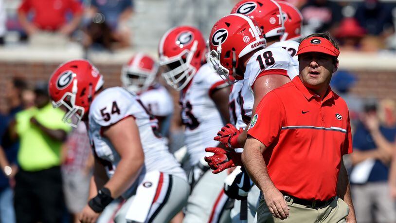 September 24, 2016 Oxford, Miss: Georgia Bulldogs head coach Kirby Smart runs pre-game warm ups with the intensity of a tied ballgame in the 4th quarter. Preparing to take on Ole Miss in Oxford Saturday September 24, 2016. BRANT SANDERLIN/BSANDERLIN@AJC.COM