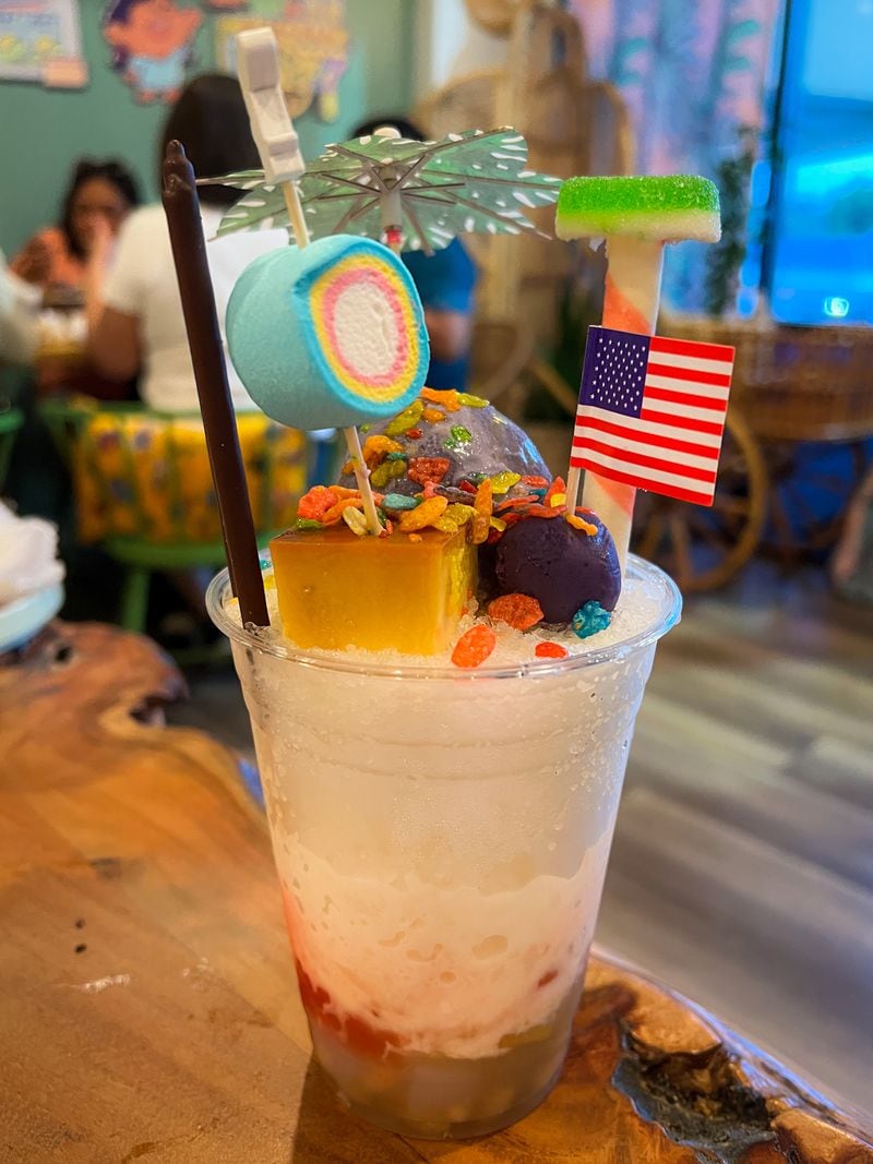 Kamayan's version of halo-halo, a Philippine dessert drink, is topped with candy, marshmallows and ube ice cream. Henri Hollis/henri.hollis@ajc.com