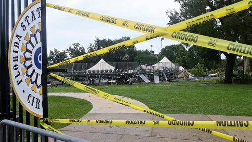 Caution tape blocks the path to Florida State University's Flying Circus bleachers that were damaged when the tent above them collapsed during strong weather in Tallahassee, Friday, May 10, 2024. Powerful storms bringing the threat of tornadoes continued to slam several southern states early Friday, as residents cleared debris from deadly severe weather that produced twisters in Michigan, Tennessee and other states. Some of the strongest storms early Friday rolled into Tallahassee. (AP Photo/Phil Sears)