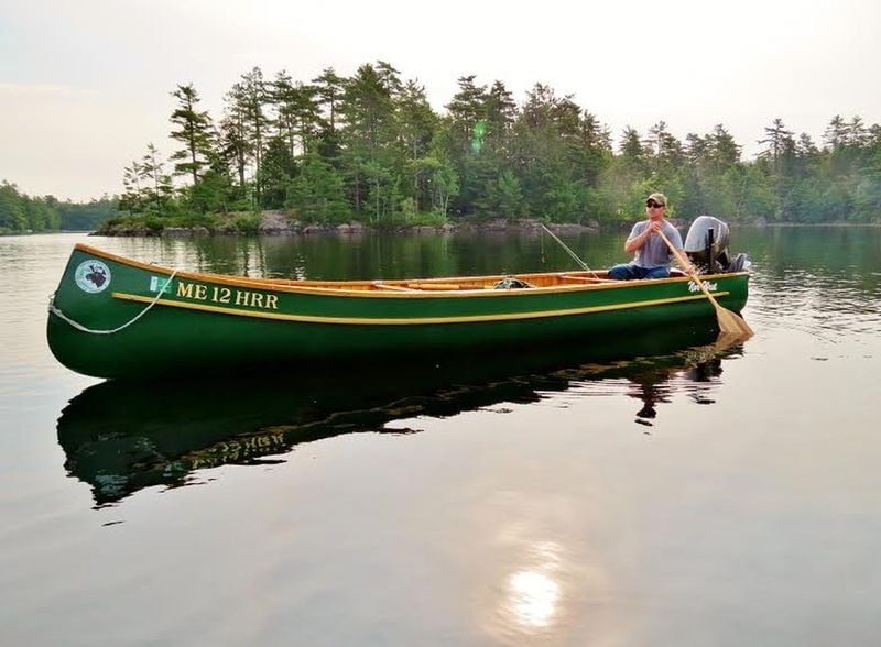 A cedar and canvas freighter canoe can handle heavy loads and sneak up on big fish in just inches of water. CONTRIBUTED BY WWW.MIKEKINNEYMAINEGUIDE.COM