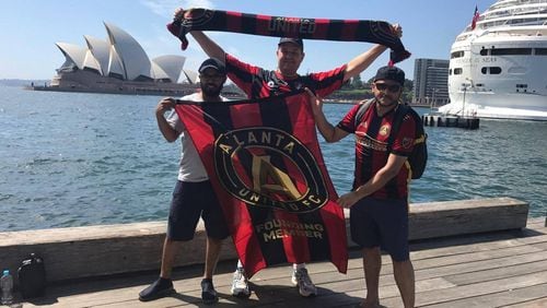 Atlanta United superfan Nick Punal of Sydney, Australia (center) poses with another Atlanta United fan, Atlanta resident Alberto Polanco (right), and an unidentified man who joined in for the photograph. (Photo courtesy of Nick Punal)