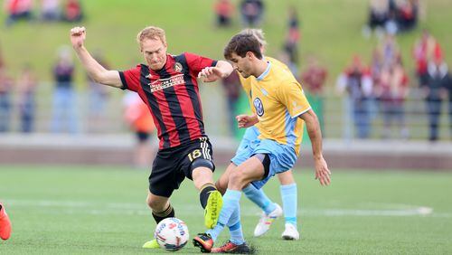 FEBRUARY 11, 2017 CHATTANOOGA TN Midfielder Jeff Larentowicz (18) try to pass a Chattanoga defender.