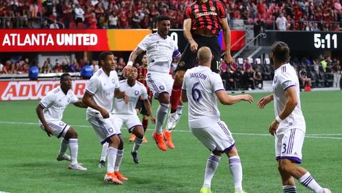 May 12, 2019 Atlanta: Atlanta United defender Miles Robinson trys to head a corner kick into the net against a host of Orlando City defenders during the first half in a MLS soccer match on Sunday, May 12, 2019, in Atlanta.  Curtis Compton/ccompton@ajc.com