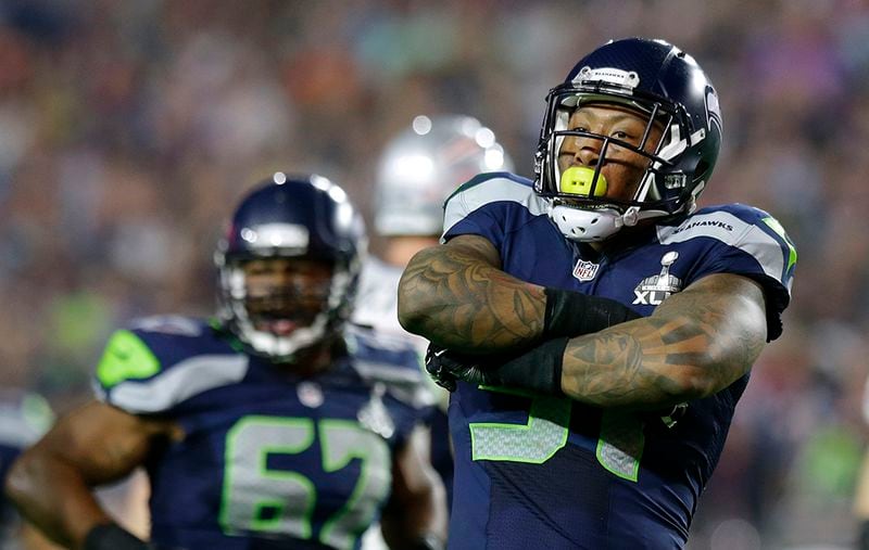 Seattle Seahawks outside linebacker Bruce Irvin (51) celebrates after sacking New England Patriots quarterback Tom Brady during the second half of NFL Super Bowl XLIX football game Sunday, Feb. 1, 2015, in Glendale, Ariz. (AP Photo/Michael Conroy) Once thought to be a risky first-round draft pick and a one-trick pony in the NFL that could only rush the passer, Seattle linebacker Bruce Irvin has developed into a defensive player that never leaves the field. (Michael Conroy / AP)