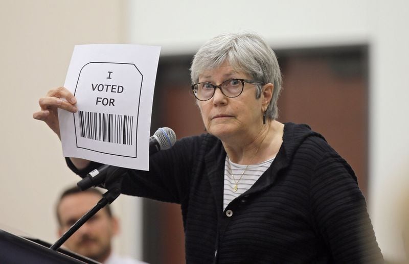 Susan McWethy from Decatur speaks against the use of bar codes and QR codes in vote printouts at the second meeting of Secretary of State Brian Kemp's Secure, Accessible & Fair Elections Commission on Aug. 30, 2018.  BOB ANDRES  /BANDRES@AJC.COM