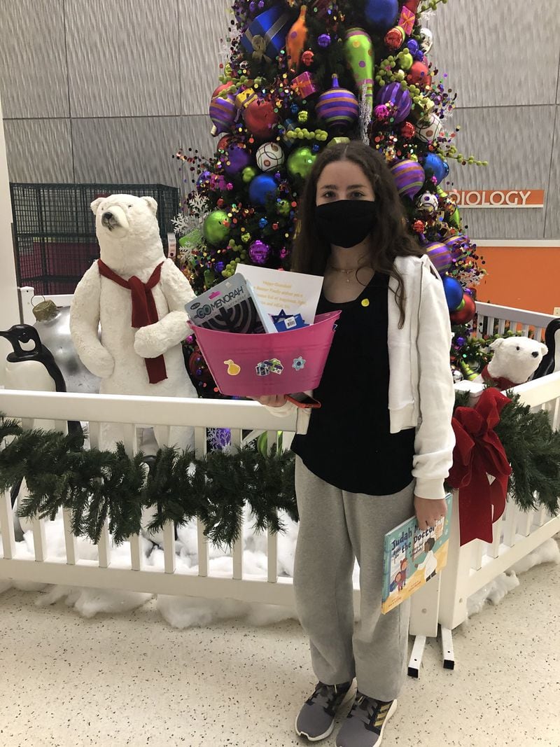 Anna Banner, 13, drops off Hanukkah goodies and decorations to Children's Healthcare of Atlanta. She has been doing this for other children who celebrate Hanukkah the past nine years. (Courtesy of Children's Healthcare of Atlanta)