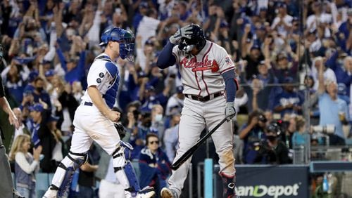 Atlanta Braves center fielder Adam Duvall, right, strikes out to end the game.  Curtis Compton / curtis.compton@ajc.com