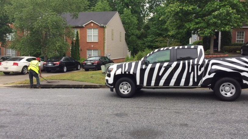 East Point hired Lowe Engineers to inventory the storm water conveyance system. City officials urge residents not to be alarmed when they see the zebra-striped trucks, a trademark of the company, in the area. CONTRIBUTED