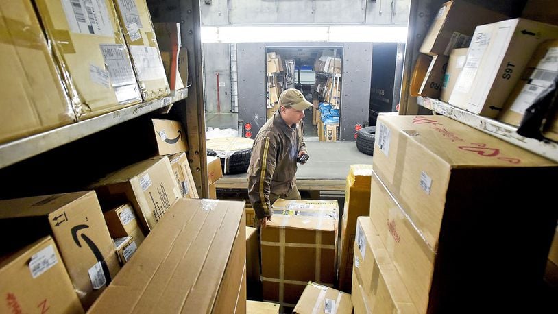 UPS driver Andrew Hancock checks the load before leaving on the day’s deliveries at the UPS depot in 2015 in Jackson, Pa. (Bob Donaldson/Pittsburgh Post-Gazette/TNS)