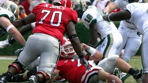 University of Georgia quarterback Matthew Stafford loses the ball near midfield, but Georgia's Nick Jones (70) recovers the fumble at Sanford Stadium on Saturday, September 16, 2006. (KEITH HADLEY/AJC staff)