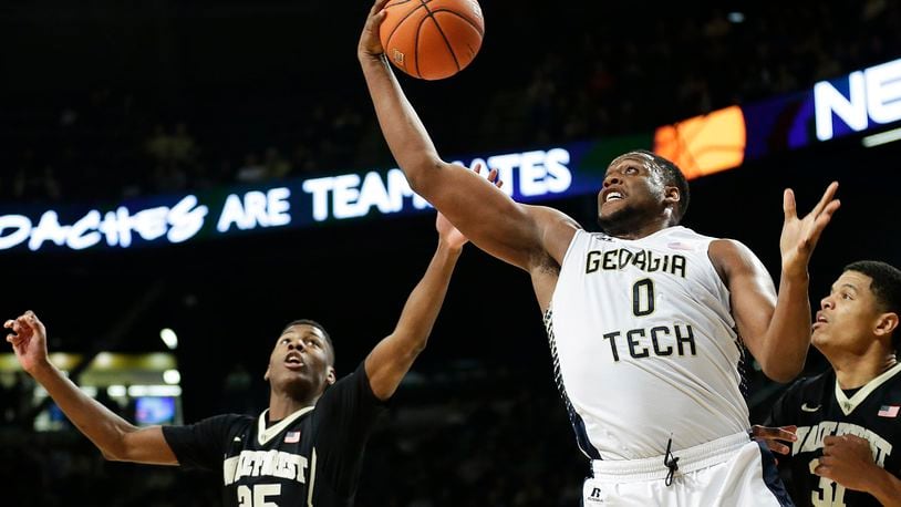 Georgia Tech's Charles Mitchell, right, grabs a rebound from Wake Forest's Cornelius Hudson, left, in the second half of an NCAA college basketball game, Saturday, Feb. 7, 2015, in Atlanta. Georgia Tech won 73-59. (AP Photo/David Goldman)