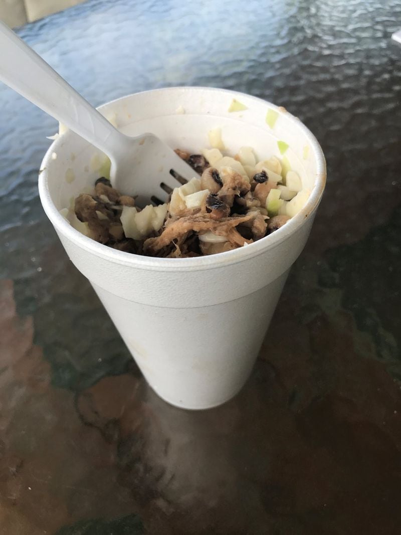 The BBQ Sundae at Overlook BBQ layers pulled pork, seasoned						cabbage and black-eyed peas in a Styrofoam to-go cup. Just add						some barbecue sauce and stir it up. LIGAYA FIGUERAS /						LFIGUERAS@AJC.COM