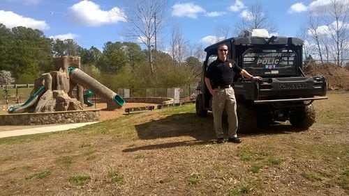 With federal funding, shade structures will be added to the playground at the Silver Comet Trail Linear Park in Powder Springs. Justin Arndt, a police officer with the city, helps monitor the trail. Contributed