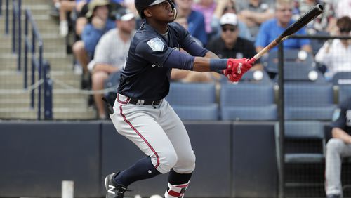 Ronald Acuna watches the path of the ball on his home run Friday against the New York Yankees. (AP Photo/Lynne Sladky)