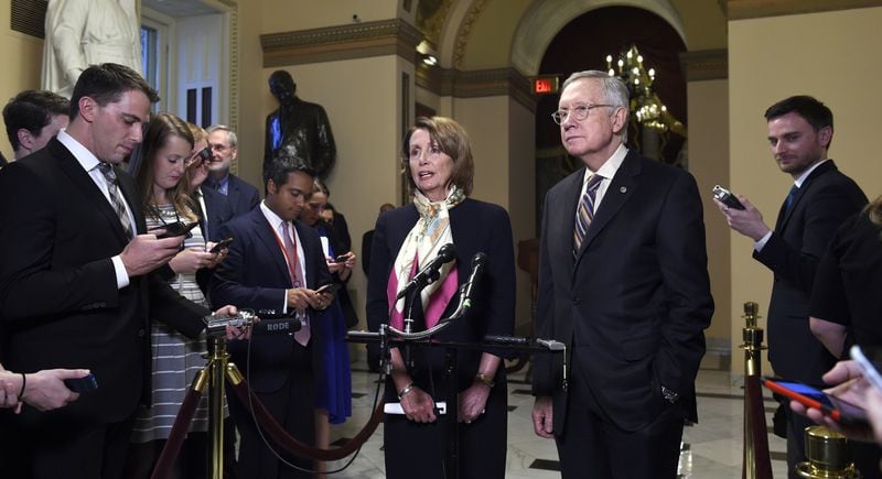 House Democratic Leader Nancy Pelosi of Calif., center, speaks as Senate Minority Leader Harry Reid of Nev., second from right, listens as she talks to reporters on Capitol Hill in Washington, Wednesday, Oct. 28, 2015, about the passage of a budget by the House. (AP Photo/Susan Walsh)