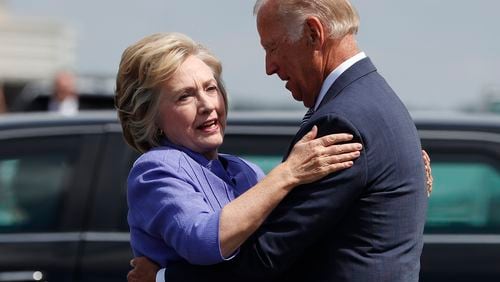 Democratic presidential candidate Hillary Clinton greets Vice President Joe Biden on the tarmac at Wilkes-Barre/Scranton International Airport in Avoca, Pa., on Aug. 15, 2016, before traveling together to a campaign event in Scranton, Pa.