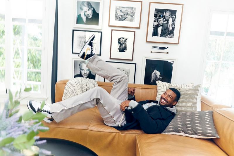 Actor Charles Michael Davis poses with his photo collection, including images of Malcolm X and Muhammad Ali purchased from Jackson Fine Art.
Courtesy of Josh Telles