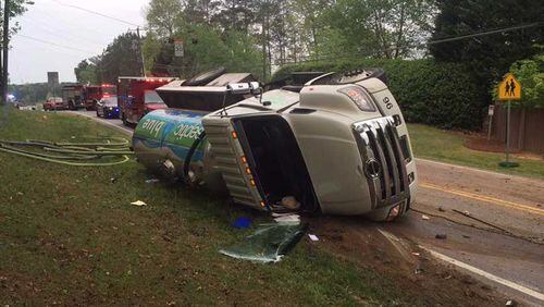 An overturned septic tank, that had to unloaded to be put back on it wheels, made East Cherokee Drive at Copper Ridge Drive unpleasant to drive through Tuesday morning.
