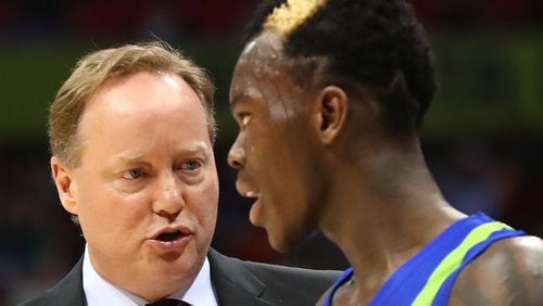 Atlanta Hawks head coach Mike Budenholzer speaks with guard Dennis Schroder benching him in the third quarter for the remainder of the game against the Golden State Warriors during a NBA basketball game on Monday, March 6, 2017, in Atlanta.   Curtis Compton/ccompton@ajc.com