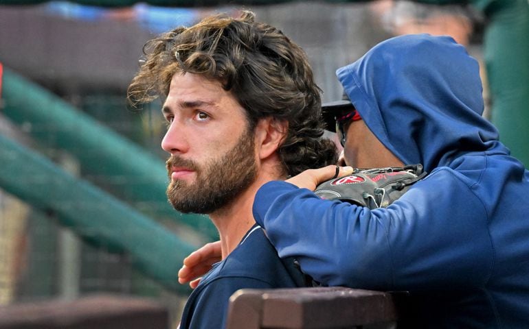 Braves shortstop Dansby Swanson is emotional in the dugout as the Phillies celebrate their 8-3 win Saturday. (Hyosub Shin / Hyosub.Shin@ajc.com)