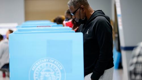 People cast their votes in Georgia during the first day of early voting of the general elections on Oct. 17, 2022. (Miguel Martinez/AJC)