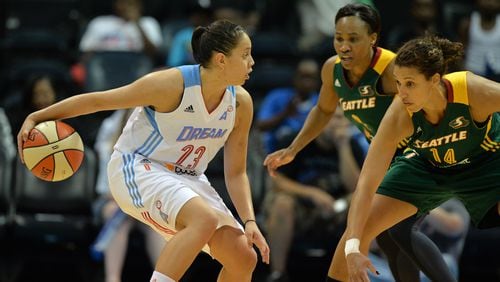 May 30, 2014 Atlanta: Atlanta Dream's Shoni Schimmel works works against Seattle Storm's Nicole Powell during the second half at Phillips Arena Friday May 31, 2014. BRANT SANDERLIN /BSANDERLIN@AJC.COM .