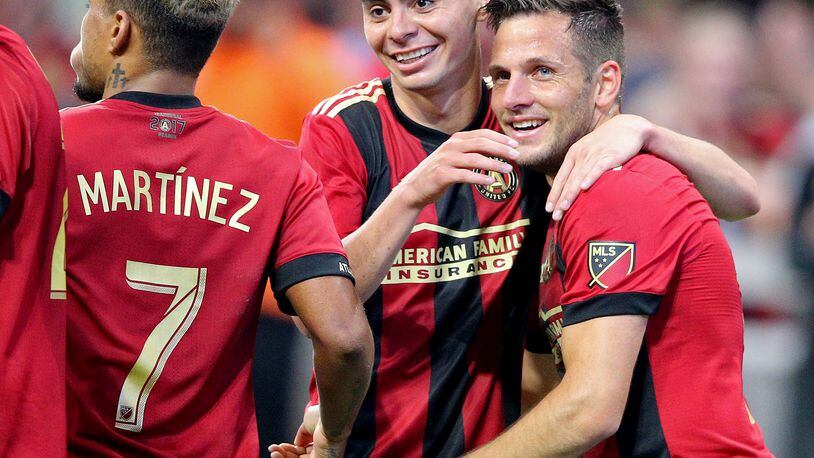 April 28, 2018 Atlanta: Atlanta United midfielder Kevin Kratz (right) celebrates scoring his second goal of the game, both on free kicks, with Miguel Almiron for a 4-1 victory over the Montreal Impact in a MLS soccer match on Saturday, April 28, 2018, in Atlanta. Almiron also scored two goals in the game. Curtis Compton/ccompton@ajc.com