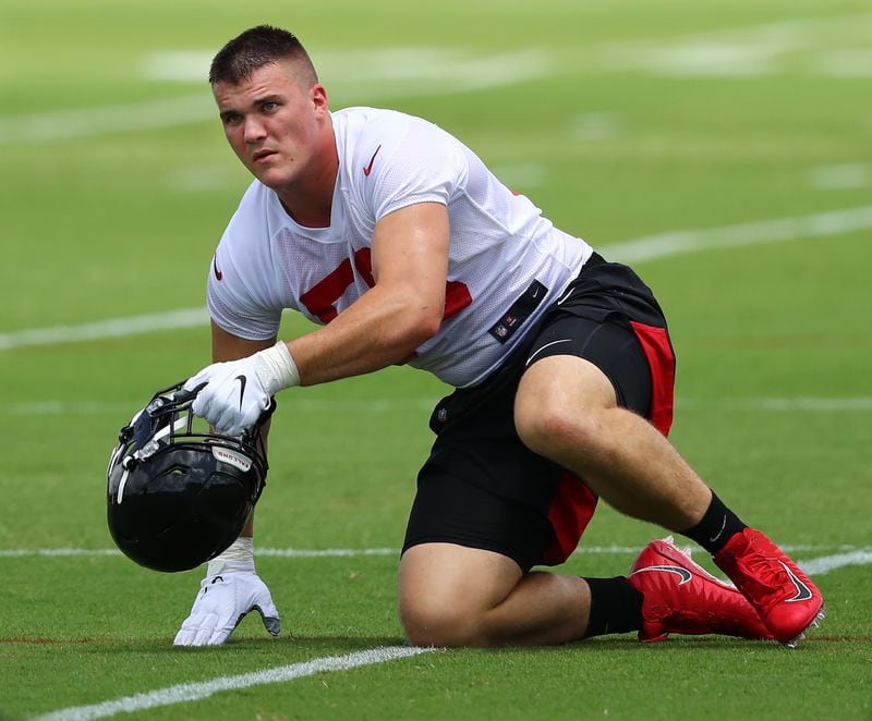 Falcons defensive end John Cominsky loosens up on the first day of rookie minicamp on Friday, May 10, 2019, in Flowery Branch.  Curtis Compton/ccompton@ajc.com