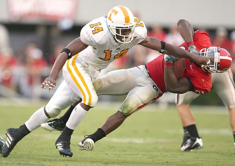 Moreno is taken down by Tennessee cornerback Eric Berry, who attended Creekside High School in South Fulton.