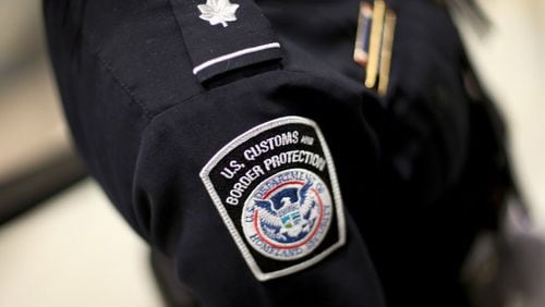 U.S. Customs and Border Protection officer's patch is seen March 4, 2015, as they unveil a new mobile app for international travelers arriving at Miami International Airport.