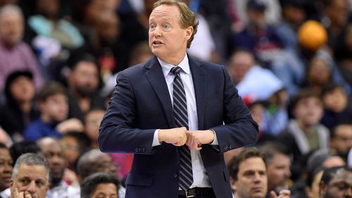 Hawks coach Mike Budenholzer gestures during the second half of the team's NBA basketball game against the Washington Wizards, Friday, April 6, 2018, in Washington. The Hawks won 103-97. (AP Photo/Nick Wass)