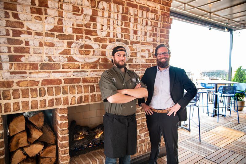 UP on the Roof executive chef Max Tezza and general manager Pierce Brooks. (Mia Yakel for The Atlanta Journal-Constitution)