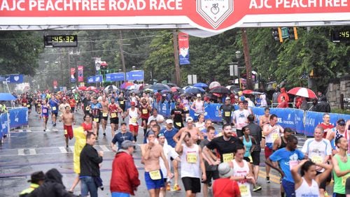 After 6.2 miles through the heart of Atlanta, runners reach the finish of the 2015 AJC Peachtree Road Race. (HYOSUB SHIN / HSHIN@AJC.COM)