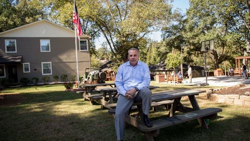Tyler Bowser sits on the picnic tables at the Veterans Empowerment Organization facility in Atlanta. The VEO helped turn Bowser’s life around, and he’s now a full-time VEO ambassador. STEVE SCHAEFER / SPECIAL TO THE AJC