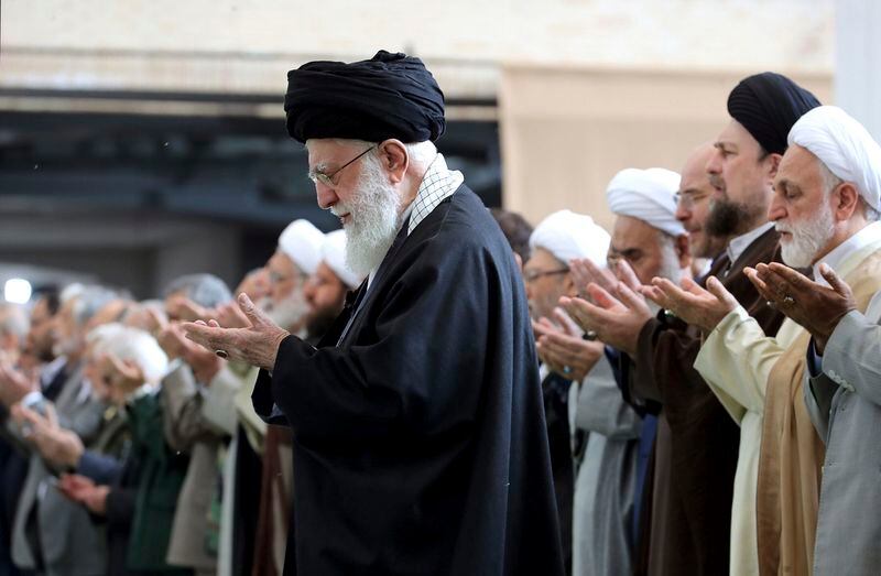 In this photo released by the official website of the office of the Iranian supreme leader, Supreme Leader Ayatollah Ali Khamenei leads Eid al-Fitr prayer marking the end of the Muslims holy fasting month of Ramadan, in Tehran, Iran, Wednesday, April 10, 2024. Ayatollah Khamenei reiterated on Wednesday a promise to retaliate against Israel over the killings of Iranian generals in Syria. (Office of the Iranian Supreme Leader via AP)