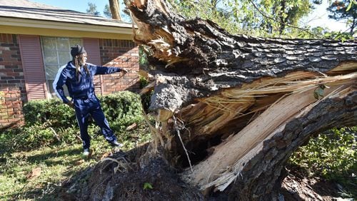 October 9, 2016 Savannah - Eric Riley surveys the damage from Hurricane Matthew in Savannah on Sunday, October 9, 2016. HYOSUB SHIN / HSHIN@AJC.COM