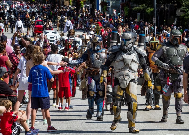 Large crowds gather along Peachtree Street Saturday to watch the  Dragon Con parade in Atlanta GA  September 2, 2017. STEVE SCHAEFER / SPECIAL TO THE AJC