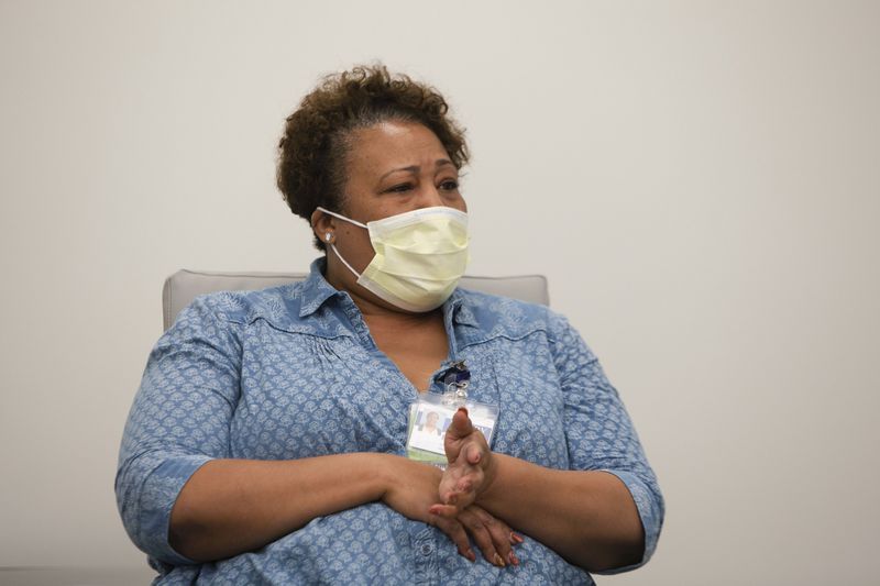 Fredetra Chapman, a patient care coordinator at the Emory Addiction Center, tells her colleagues how she used naloxone to revive someone who was found slumped over in a restaurant bathroom on Nov. 10. CHRISTINA MATACOTTA FOR THE ATLANTA JOURNAL-CONSTITUTION.