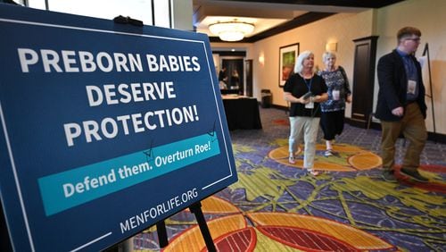 June 25, 2022 Atlanta - Attendees walk in a conference room during National Right to Life’s 51st convention at the Atlanta Airport Marriott Hotel in Atlanta on Saturday, June 25, 2022.(Hyosub Shin / Hyosub.Shin@ajc.com)