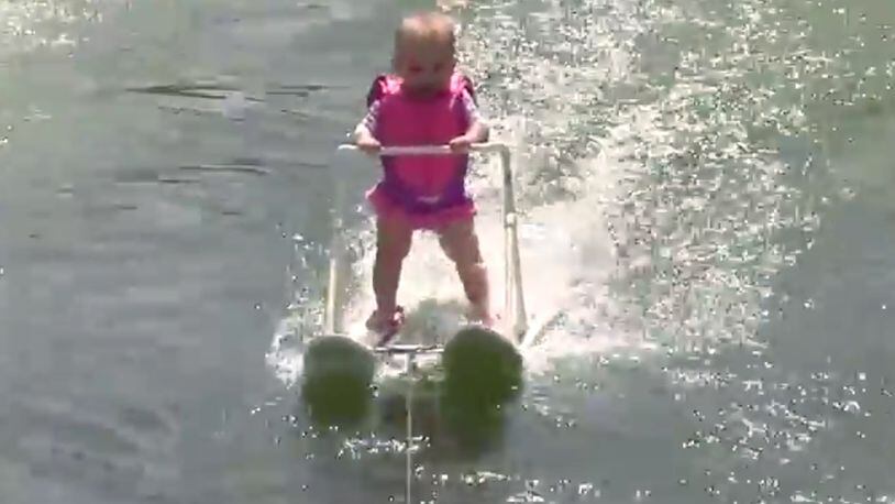 In this photo taken from a video made available by World Barefoot Center, 6-month-old Zyla St. Onge water-skis across Lake Silver in Winter Haven, Fla., on May 19, 2016.