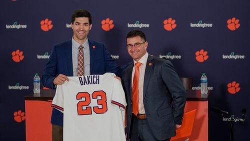 Clemson athletic director and Georgia Tech graduate Graham Neff (left) poses with new Tigers baseball coach Erik Backich at a news conference announcing his hire in June. (Clemson Athletics)