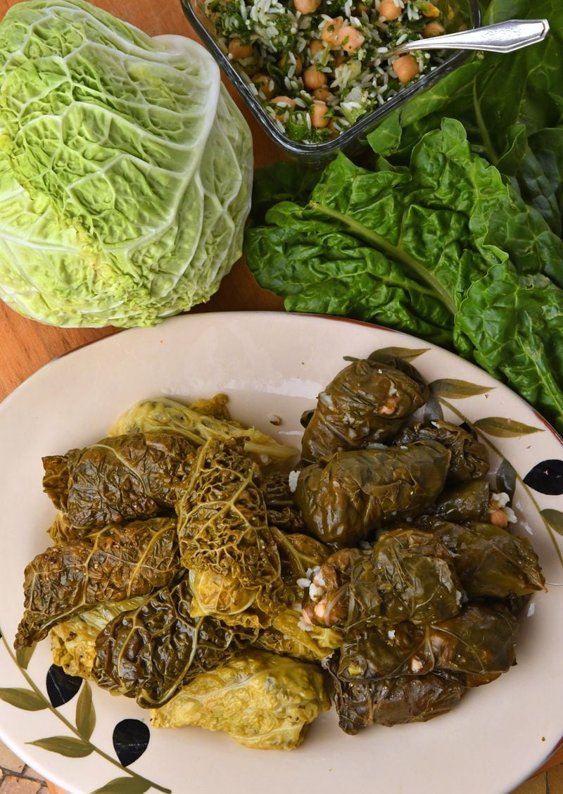 Mihshi Waraq Silq or Malfuf biz-Zayt (Stuffed Swiss Chard or Cabbage Rolls) are like stuffed grape leaves, but vegetarian. This recipe is adapted from “Lebanese Cuisine” by Madelain Farah and Leila Habib-Kirske.  (Styling by C.W. Cameron / Chris Hunt for the AJC)