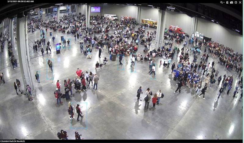 An overhead surveillance photo provided by the Georgia World Congress Center shows a vast space inside C building during the Cheersport Nationals competition on Feb. 13. Some parents complained they felt uncomfortable because of clustering near the food trucks, as seen here. (Special)