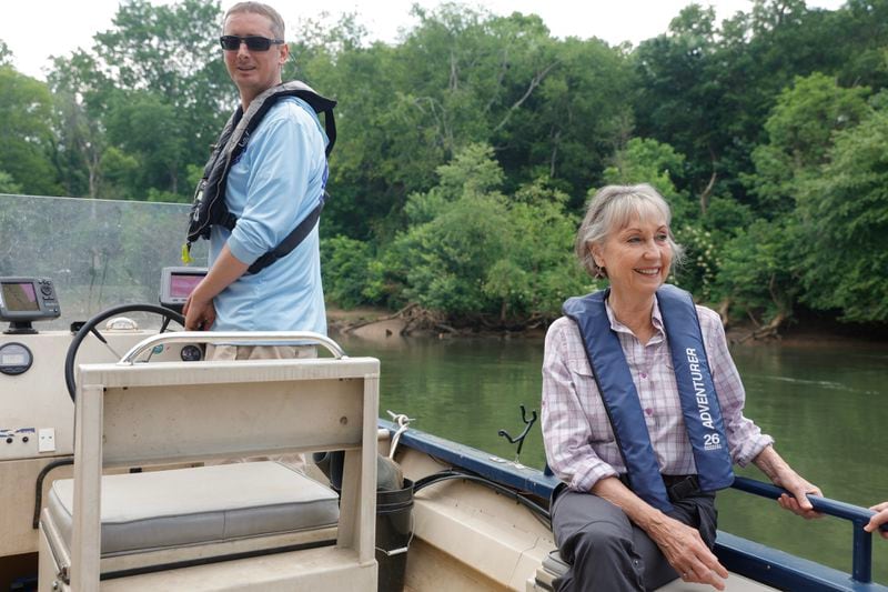 Jason Ulseth co-director of the Chattahoochee Riverkeeper and Sally Bethea, one of the founders of the nonprofit, were out for a pleasure ride on the Chattahoochee recently but still stopped to take a sample from a suspicious point source. (Natrice Miller/natrice.miller@ajc.com) 